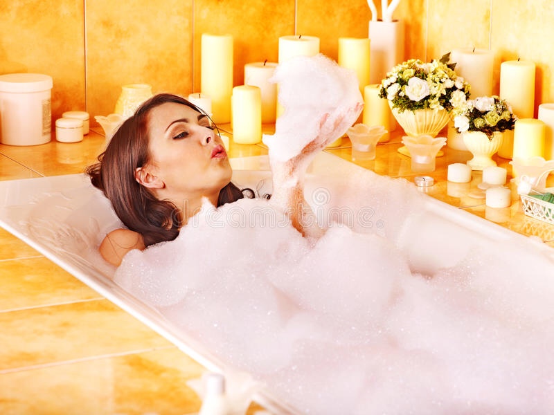 mother relaxing in bubble bath