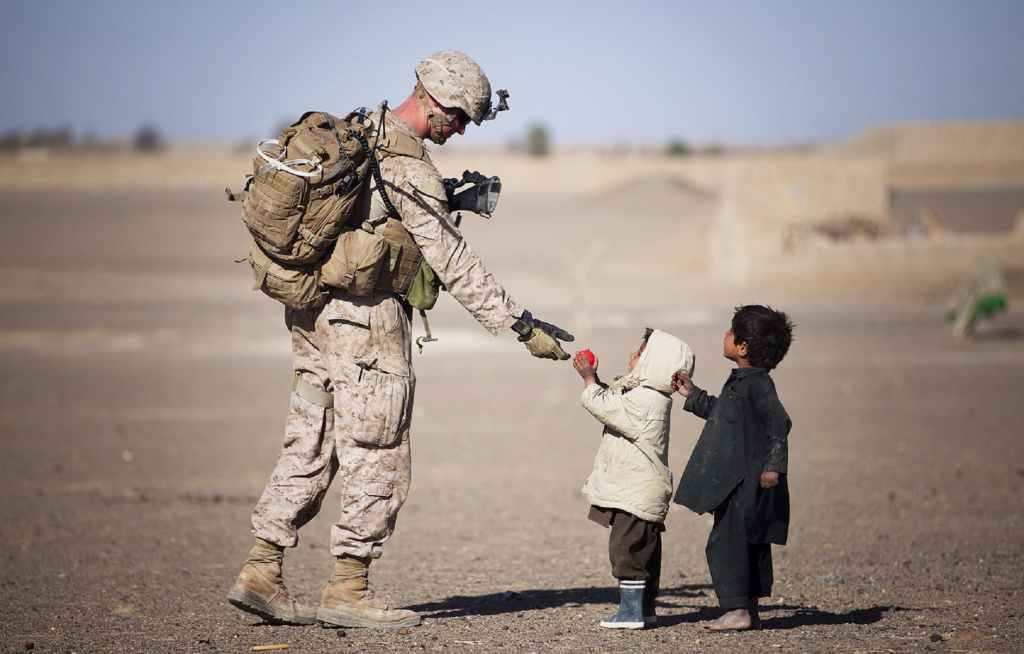 soldier caring for children