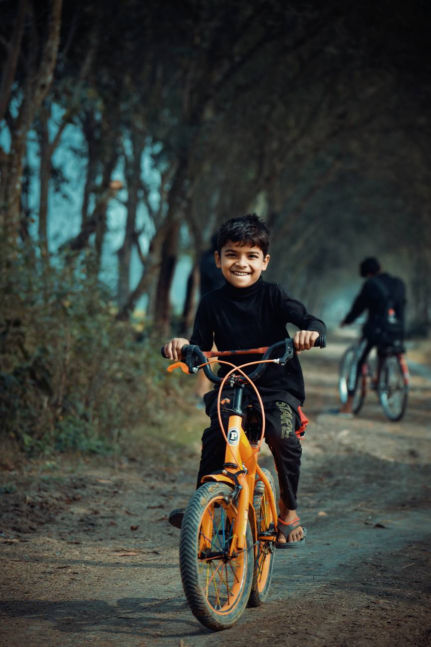 Patient child learning to ride a bike