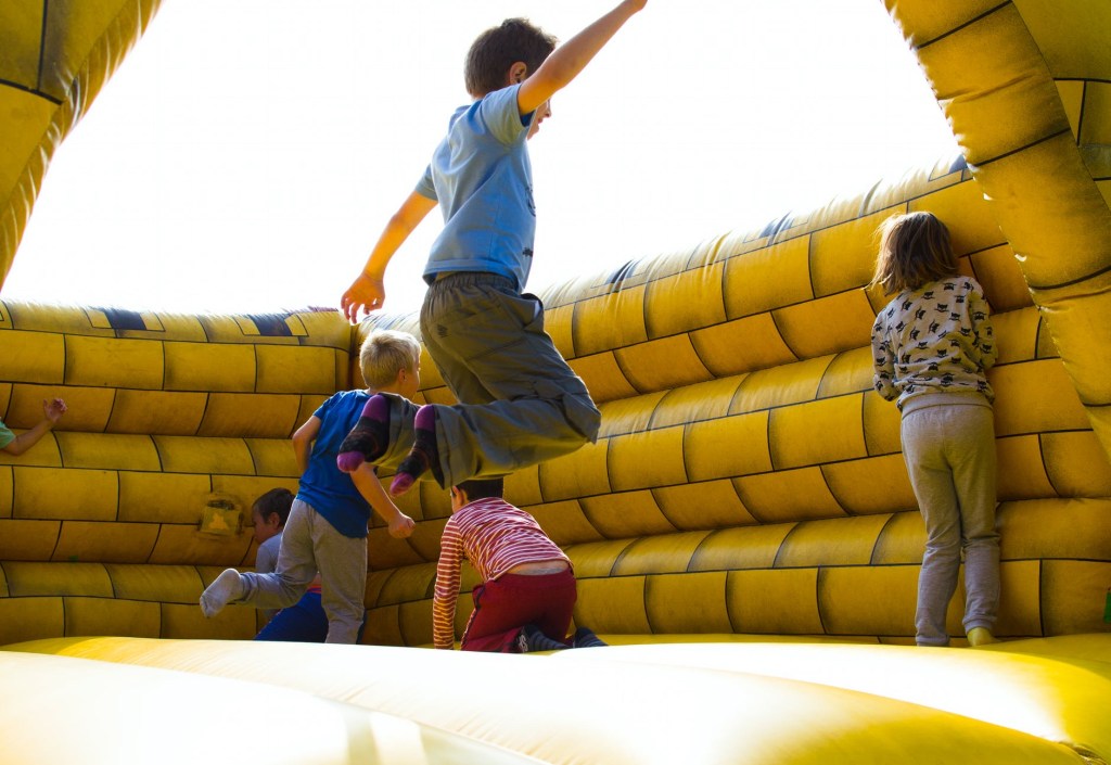 Kids jumping on a bouncy castle